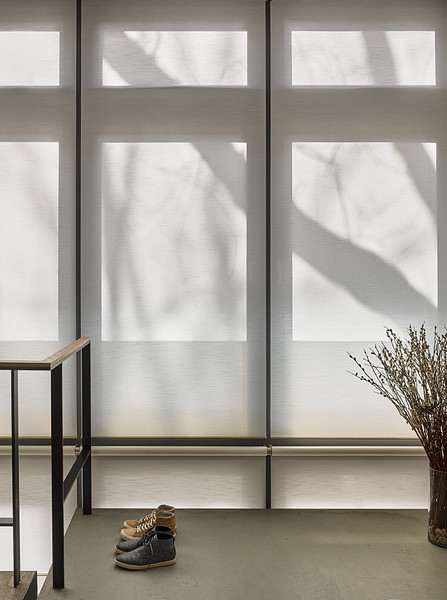 Automated shades providing privacy and glare control